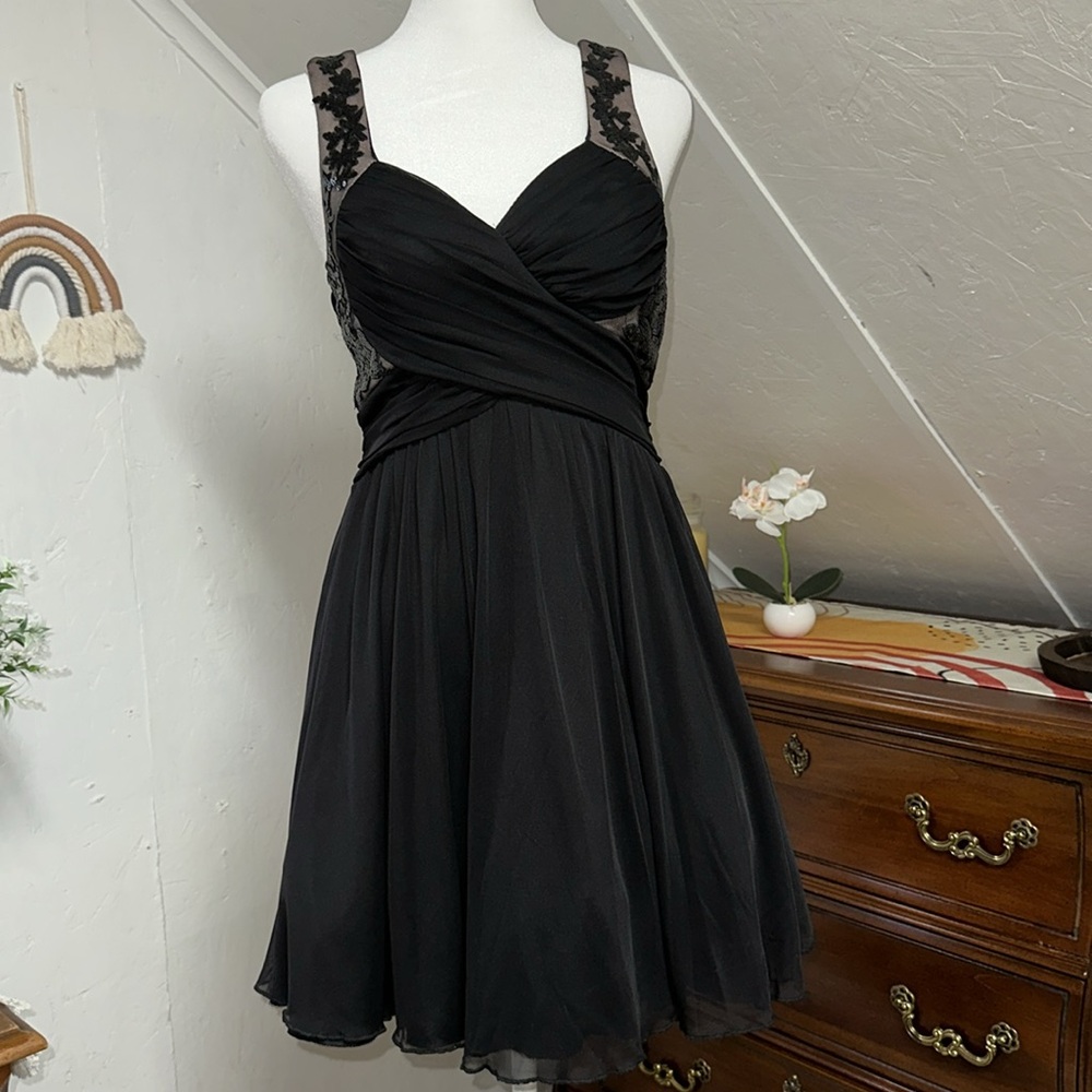 Trixxi Juniors size 3 dress. Black with multiple layers. Top‎ has stretch.